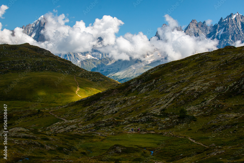 Fototapeta premium The view of Massif du Mont Blanc from the hiking trail between Refuge de Bellachat and Aiguillette des Houches, September, Les Houches, French Alps.