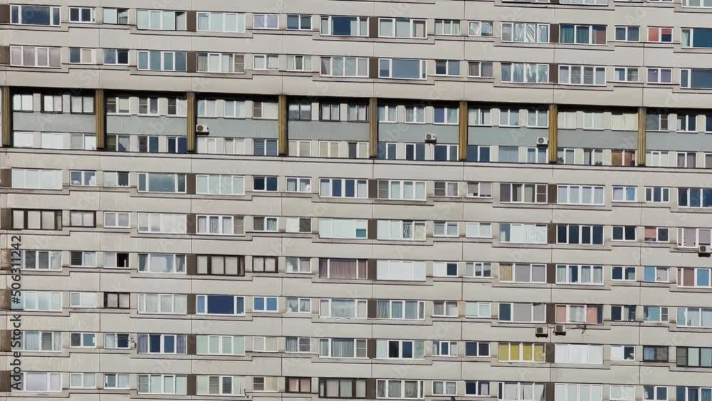 gloomy facade of an old building of a residential building of the Soviet Union, an array of windows, a ghetto gloomy facade of an old building of a residential building of the Soviet Union, an array of windows, a ghetto