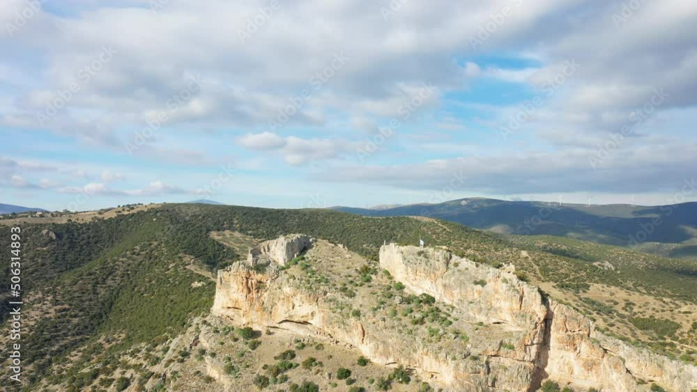 A rocky peak in Europe, Greece, Peloponnese, Argolis, towards Hermione, in summer, on a sunny day. A rocky peak in Europe, Greece, Peloponnese, Argolis, towards Hermione, in summer, on a sunny day.