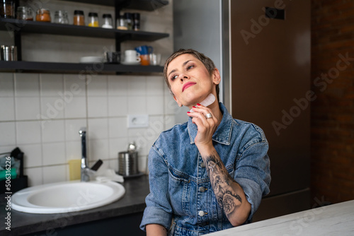 Obraz na plátně One woman mature caucasian female using gua sha rose quartz face massage stone i