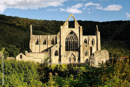 Tintern Abbey in the Wye Valley, Monmouthshire, Wales, UK. Cistercian Christian monastery founded 1131. Summer evening sunshine photo