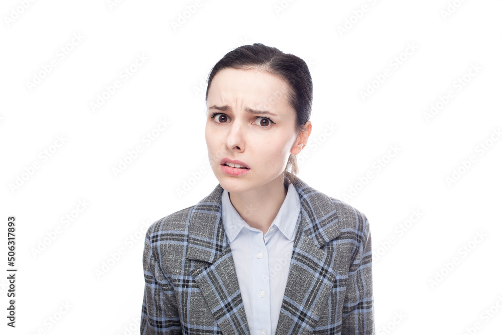 displeased businesswoman in office suit, close-up portrait, white studio background displeased businesswoman in office suit, close-up portrait, white studio background