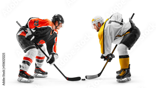 Two professional hockey players start the game. Fight for the puck. Sports emotions. Hockey concept. Isolated