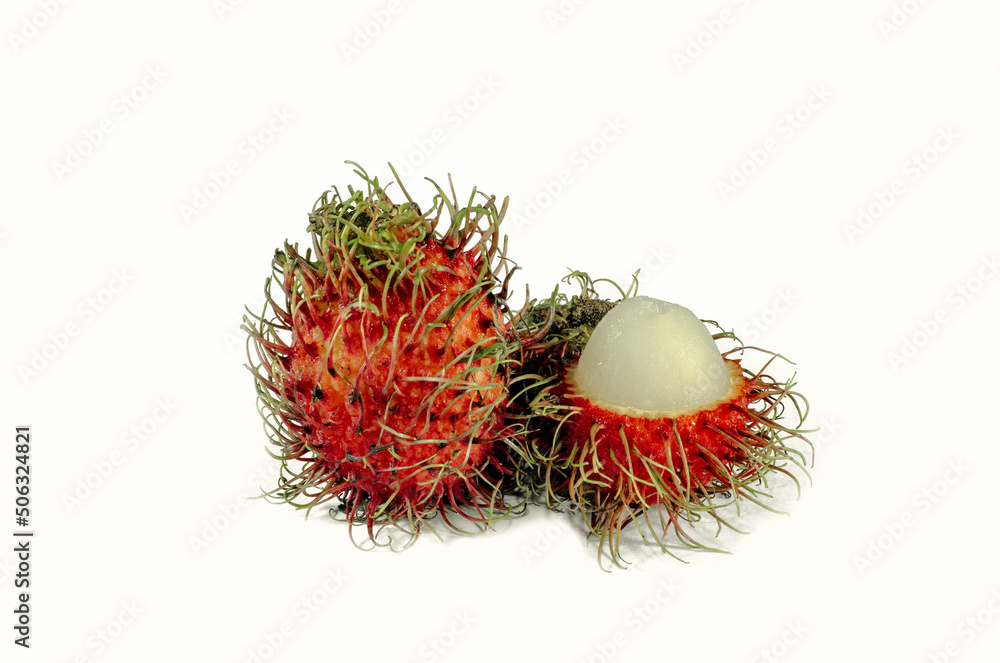 Red rambutan and half peeled rambutan on white Red rambutan and half peeled rambutan on white