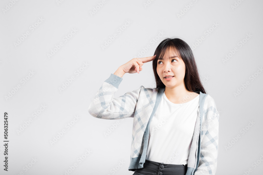 Depressed woman wanting shooting to kill herself by holding fingers on her head and looking away studio shot isolated white background, young female pointing fingers makes suicide gesture Depressed woman wanting shooting to kill herself by holding fingers on her head and looking away studio shot isolated white background, young female pointing fingers makes suicide gesture