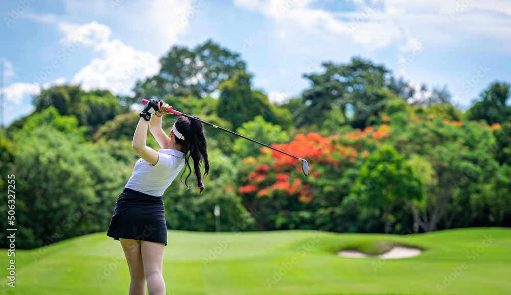 Professional woman golfer teeing golf in golf tournament competition at golf course for winner. Professional woman golfer teeing golf in golf tournament competition at golf course for winner.