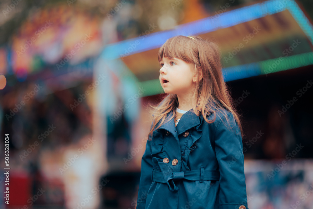 Happy Little Girl Wearing a Trench Coat in Spring Season Happy Little Girl Wearing a Trench Coat in Spring Season