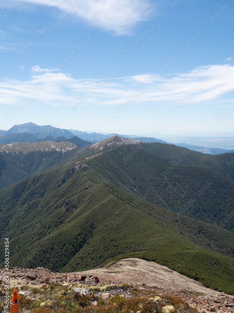 Mountain top view ridge line leading to mountain range