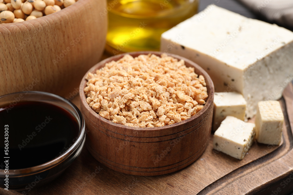Different organic soy products on wooden board, closeup Different organic soy products on wooden board, closeup