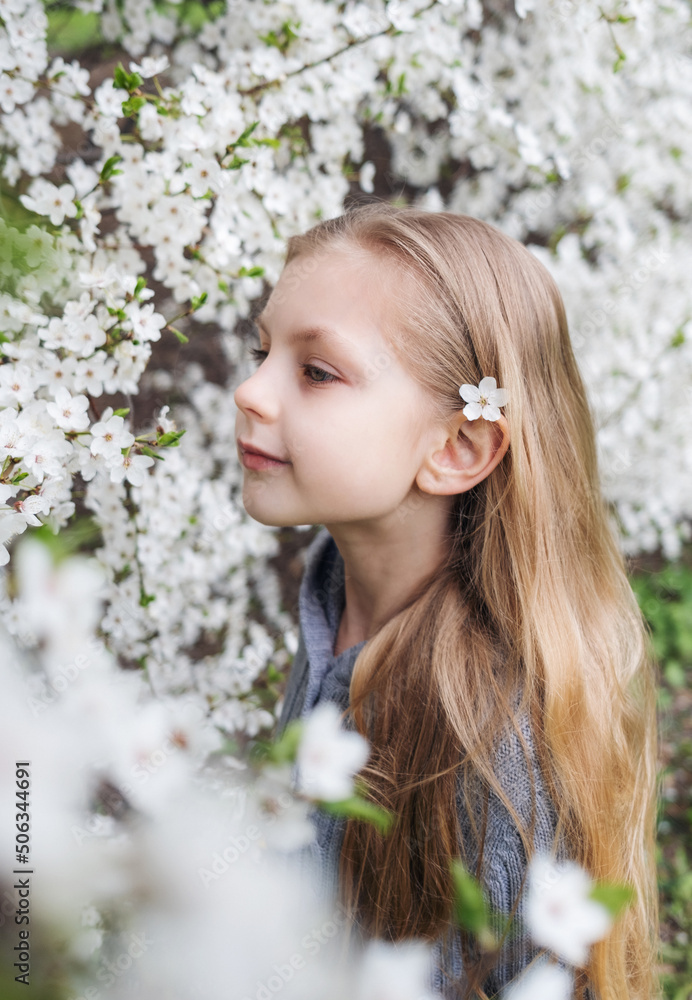 Cute little girl in a blossoming spring garden Cute little girl in a blossoming spring garden