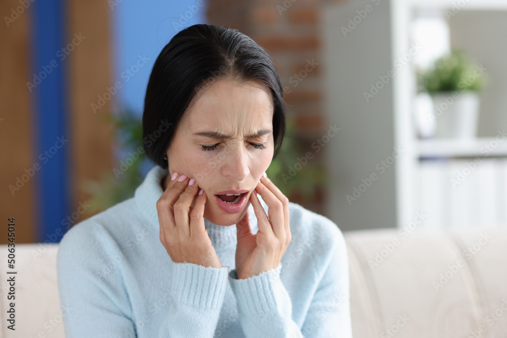 Young woman with severe acute toothache closeup Young woman with severe acute toothache closeup