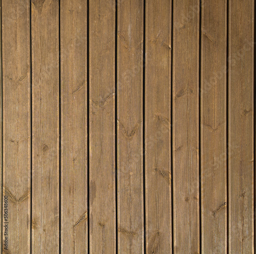 Wooden terrace with brown boards on the terrace floor. Decking without nails