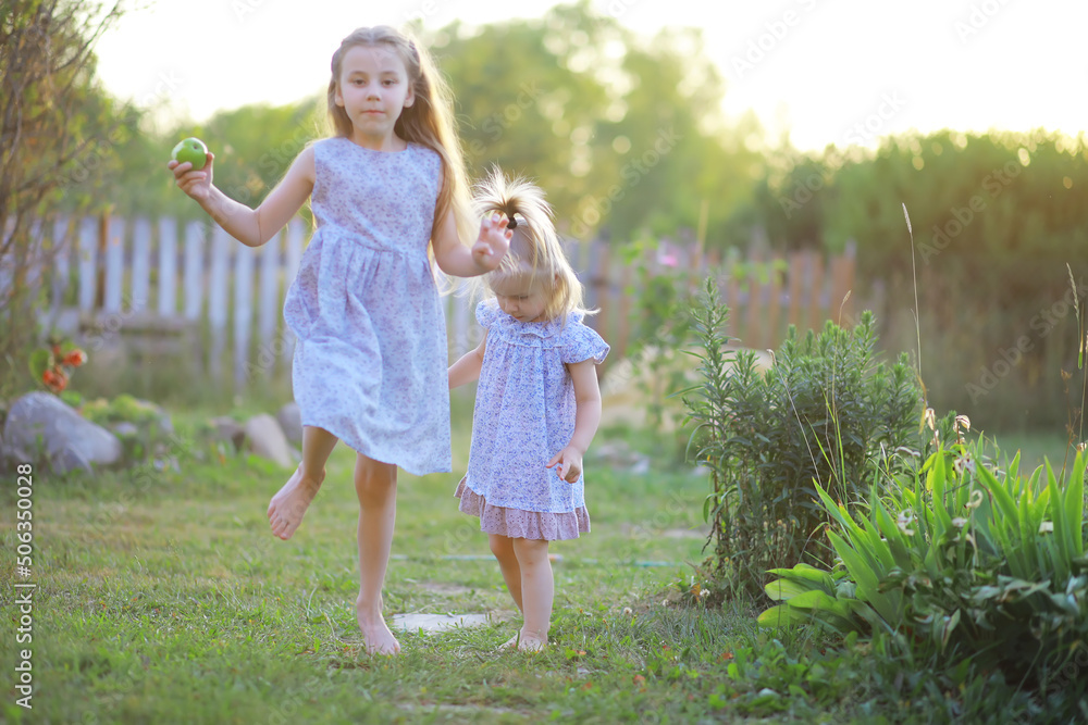Children walk in the summer in nature. Child on a sunny spring morning in the park. Traveling with children. Children walk in the summer in nature. Child on a sunny spring morning in the park. Traveling with children.