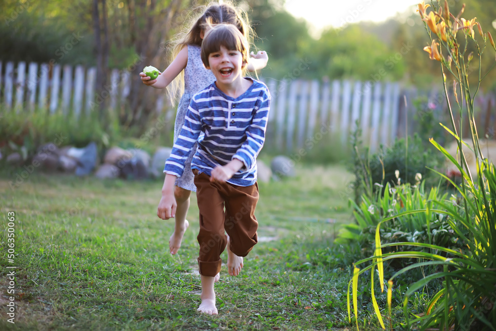 Children walk in the summer in nature. Child on a sunny spring morning in the park. Traveling with children. Children walk in the summer in nature. Child on a sunny spring morning in the park. Traveling with children.