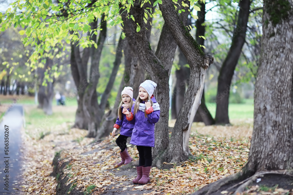 Leaf fall in the park. Children for a walk in the autumn park. Family. Fall. Happiness. Leaf fall in the park. Children for a walk in the autumn park. Family. Fall. Happiness.