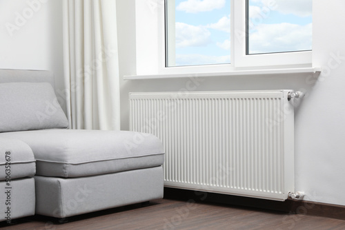 Modern radiator at home. Central heating system