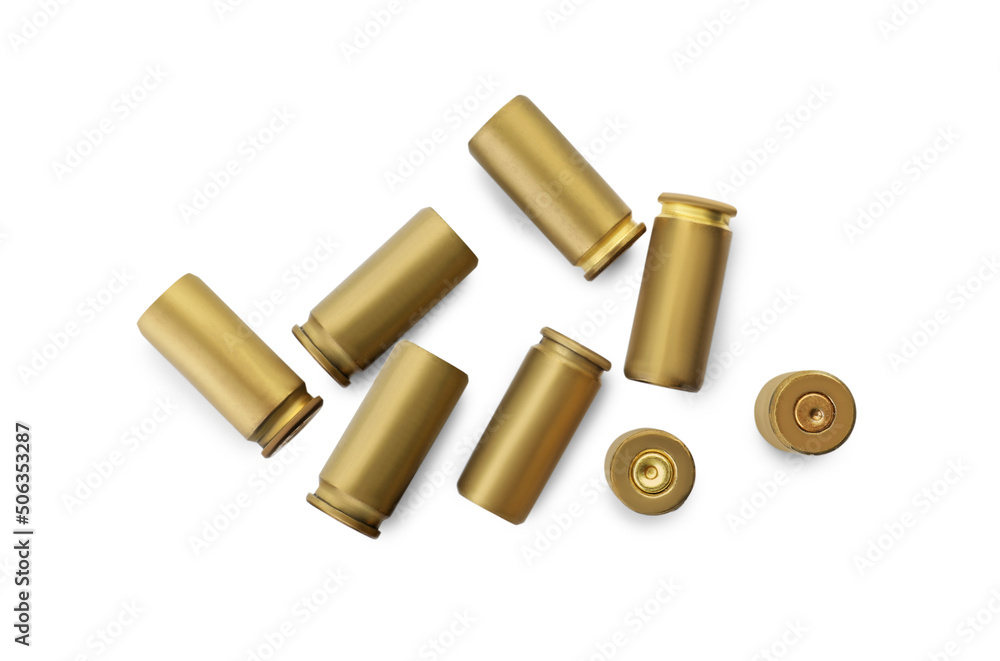 Shells of bullets on white background, top view Shells of bullets on white background, top view