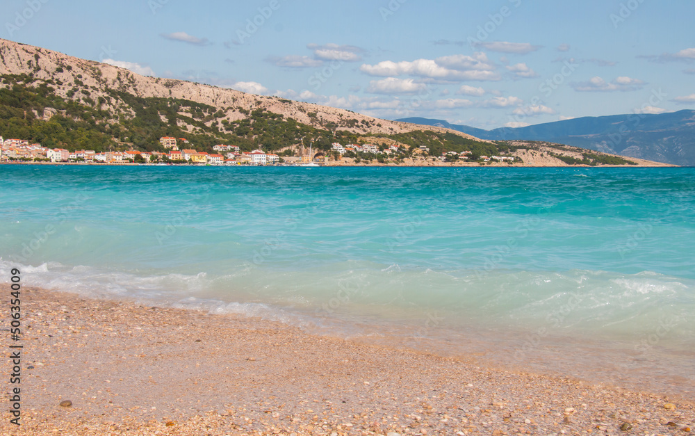 beautiful beach holiday in croatia on the island of Baska. Rest on the sand of the beautiful turquoise sea on a sunny hot summer day. Hello summer, Seascape baner. Perfect place to relax for families