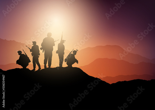 Silhouettes of soldiers on lookout in sunset landscape