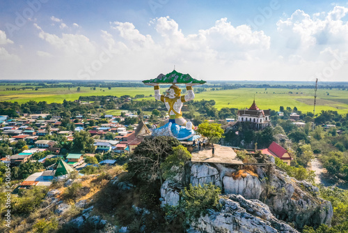Aerial view of Wat Khao Samo Khon temple, with hanuman monkey god statue on top of mountain, in Lopburi, Thailand