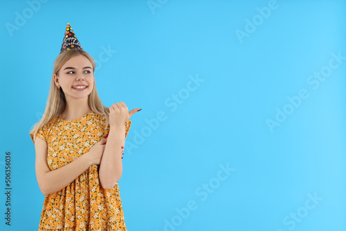 Concept of Happy Birthday with attractive girl on blue background