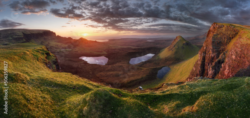Panoramic view taken at The Quiraing on the Isle of Skye, Scotland, UK. Dramatic Scottish mountain landscapes with sun