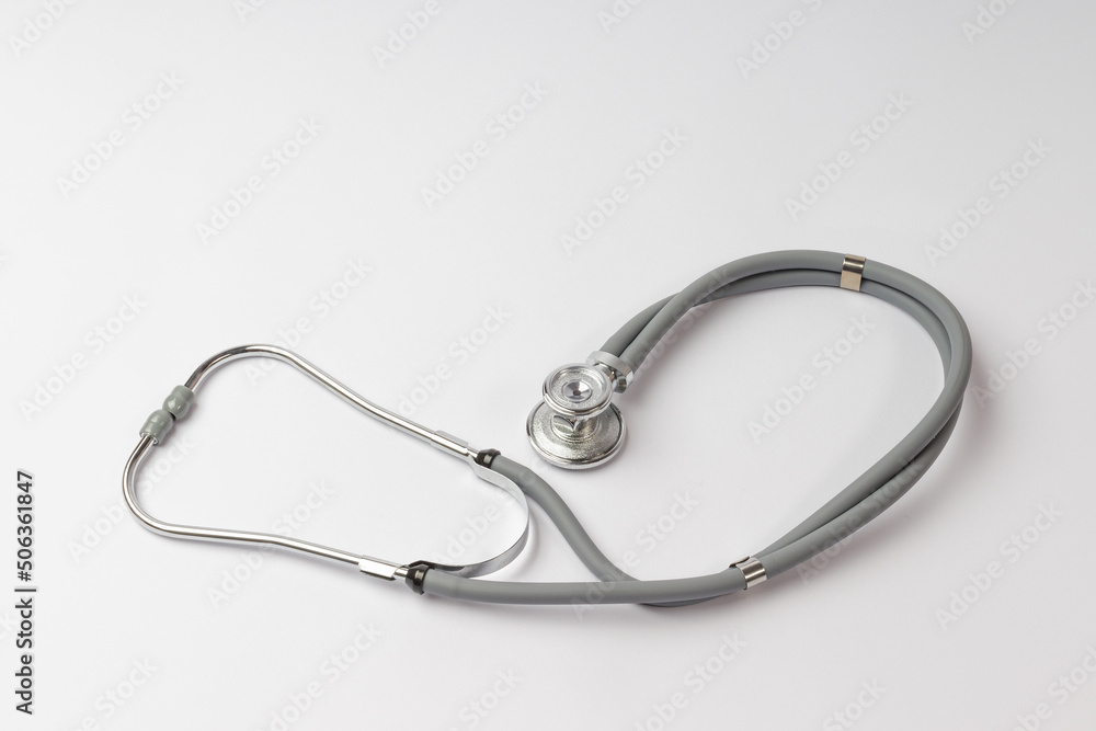 stethoscope lies on a white background, top view stethoscope lies on a white background, top view