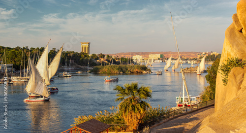 Fotografie Beautiful panorama landscape with felucca boats on Nile river in Aswan at sunset
