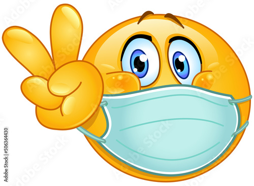 emoji emoticon with medical mask over mouth making V sign. peace, victory or vegan gesture.