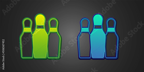 Green and blue Bowling pin icon isolated on black background. Juggling clubs, circus skittles. Vector