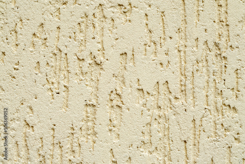 Beige plastered wall texture. Seamless surface and abstract solid background. Pale painted wall built structure.