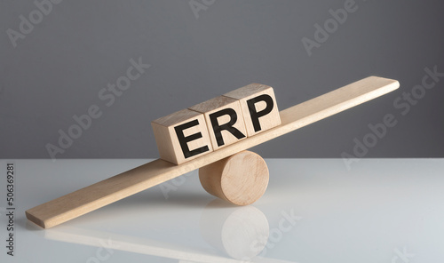 ERP on wooden cubes on a wooden balance , business concept © Iryna