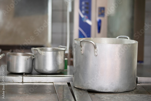 Large metal pans in an industrial kitchen.