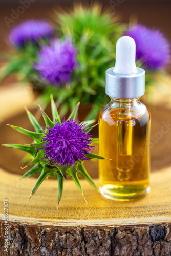 Milk thistle oil in a bottle with a pipette. Skin care.