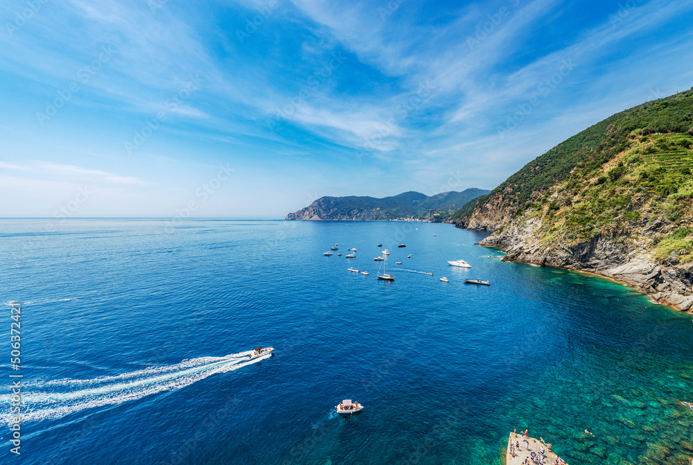 Coastline and sea of the Cinque Terre National Park, ancient village of Vernazza, Liguria, La Spezia province, Italy, Europe. UNESCO world heritage site. On the horizon Monterosso al mare village.