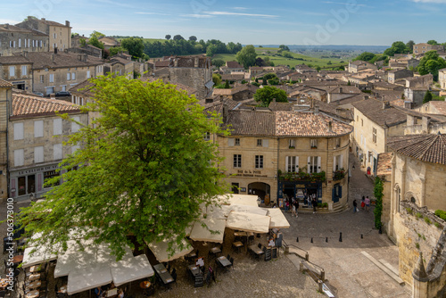 village square with shops and restaurants in the picturesque and historic medieval village of Saint-Emilion in France photo