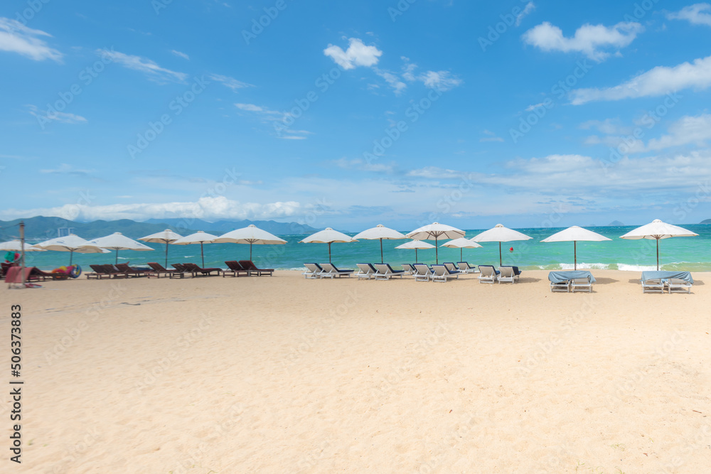 Nha Trang beach with umbrellas and chairs 