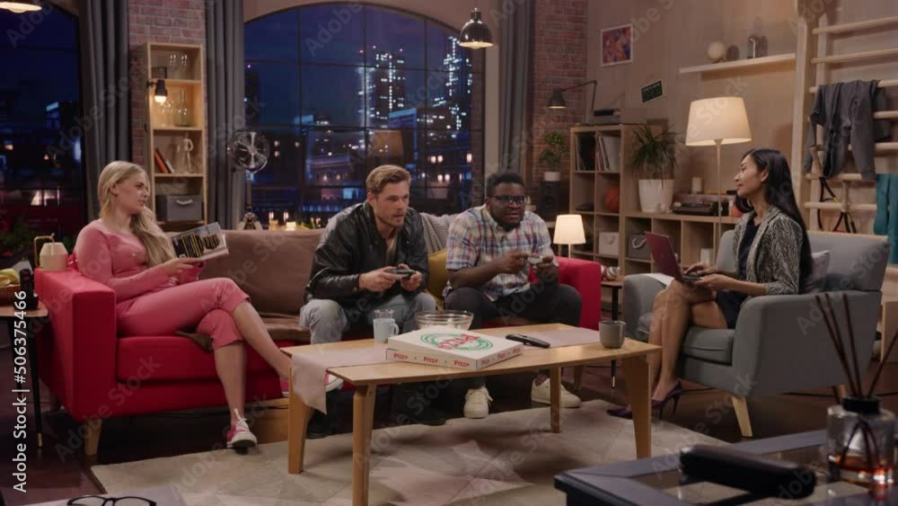 Television Sitcom: Four Diverse Friends having Fun in the Living Room. Funny TV Show Girls Reading and Working, Guys Playing Video Games on a Couch. Comedy Series on Playback Channel,Streaming Service Television Sitcom: Four Diverse Friends having Fun in the Living Room. Funny TV Show Girls Reading and Working, Guys Playing Video Games on a Couch. Comedy Series on Playback Channel,Streaming Service