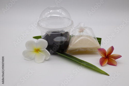 Thai dessert  grass jelly  coconut milk put in a plastic box and plastic bags.Include Clipping Path.