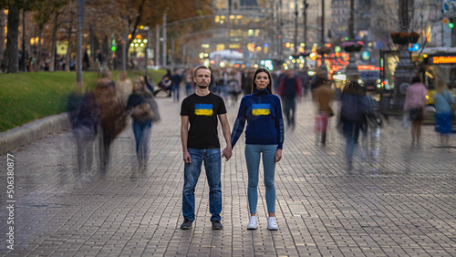 The ukrainian man and woman standing on a crowded street