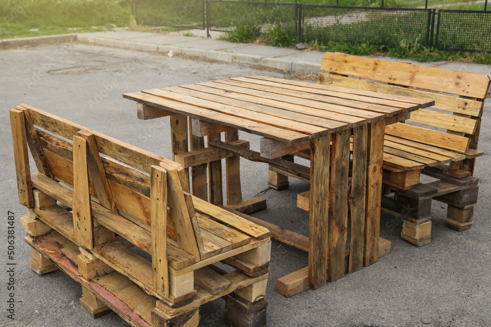 Pallet Outdoor Furniture. Rustic wooden table and benches made with pallets