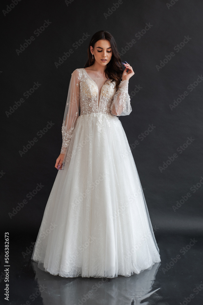 portrait of beautiful bride in wedding dress with fashion hairstyle and make-up portrait of beautiful bride in wedding dress with fashion hairstyle and make-up