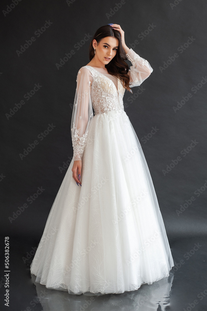 portrait of beautiful bride in wedding dress with fashion hairstyle and make-up portrait of beautiful bride in wedding dress with fashion hairstyle and make-up