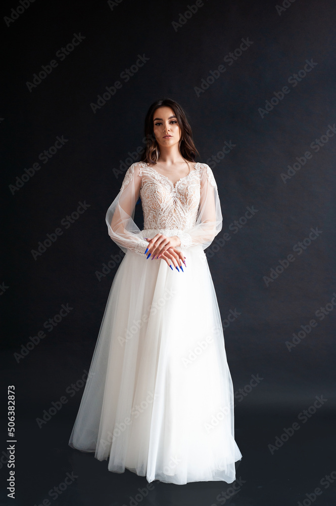 Beautiful bride perfect style. Wedding hairstyle make-up luxury wedding dress Beautiful bride perfect style. Wedding hairstyle make-up luxury wedding dress