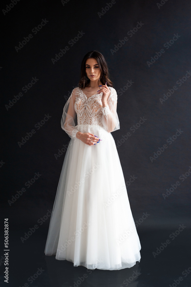Beautiful bride perfect style. Wedding hairstyle make-up luxury wedding dress Beautiful bride perfect style. Wedding hairstyle make-up luxury wedding dress