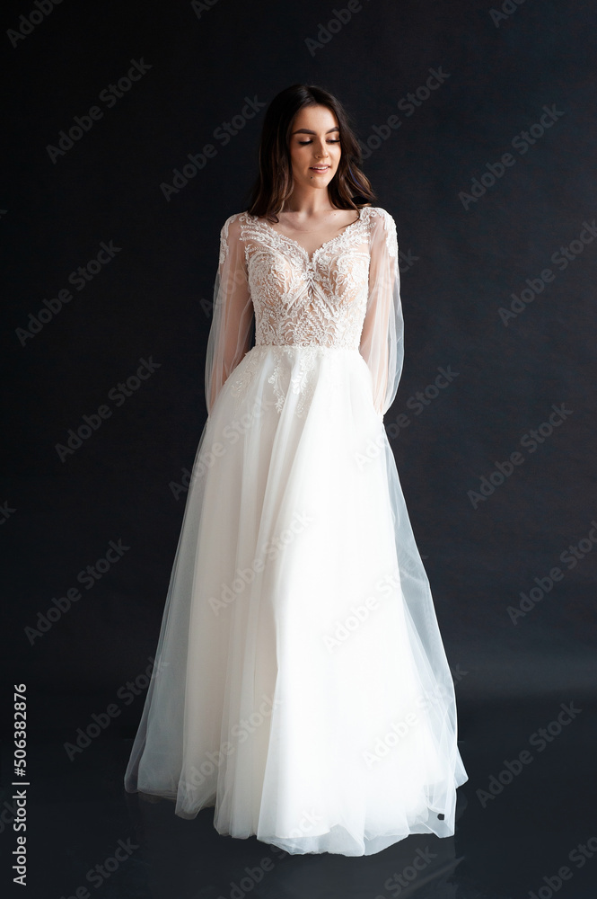 Beautiful bride perfect style. Wedding hairstyle make-up luxury wedding dress Beautiful bride perfect style. Wedding hairstyle make-up luxury wedding dress