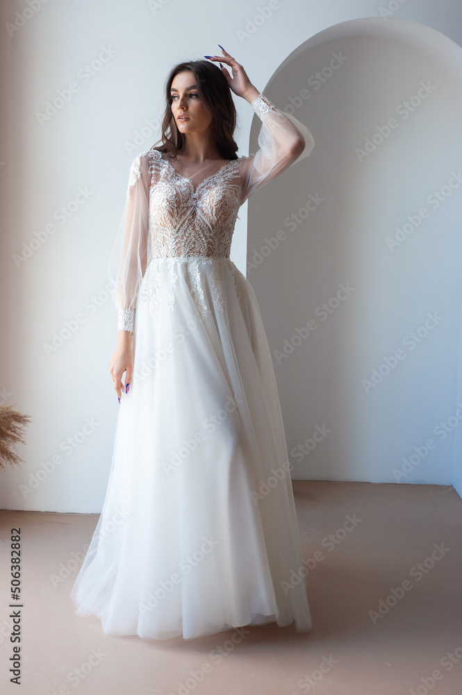 Beautiful bride perfect style. Wedding hairstyle make-up luxury wedding dress Beautiful bride perfect style. Wedding hairstyle make-up luxury wedding dress