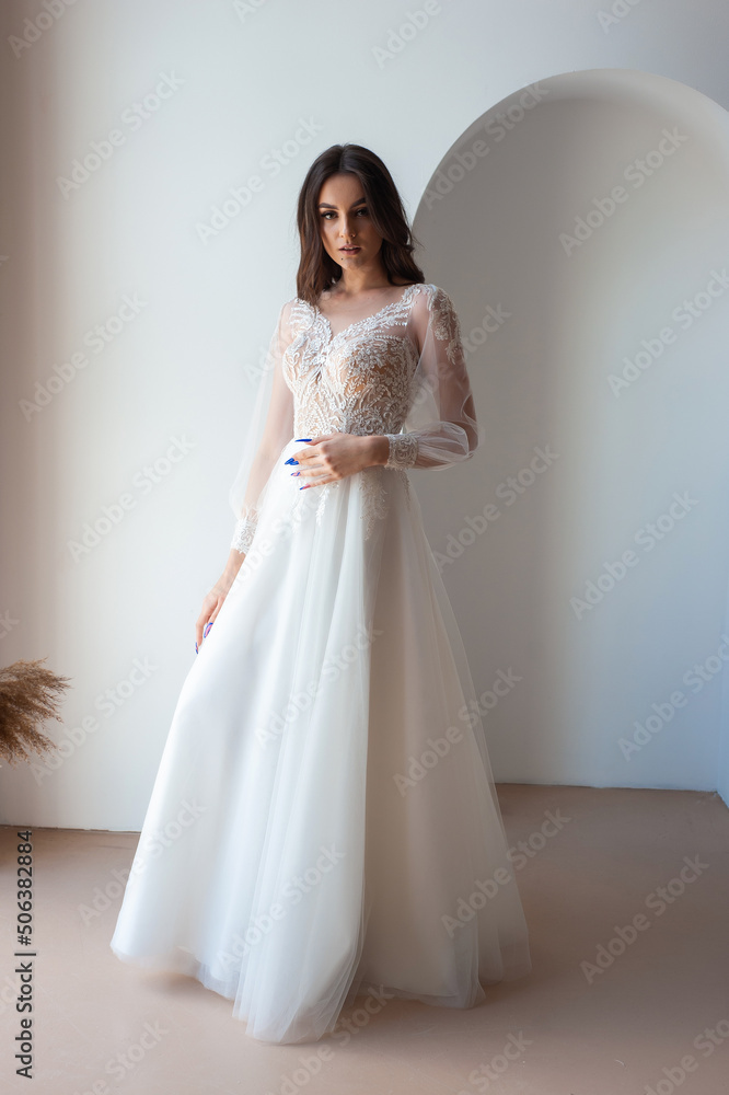 Beautiful bride perfect style. Wedding hairstyle make-up luxury wedding dress Beautiful bride perfect style. Wedding hairstyle make-up luxury wedding dress