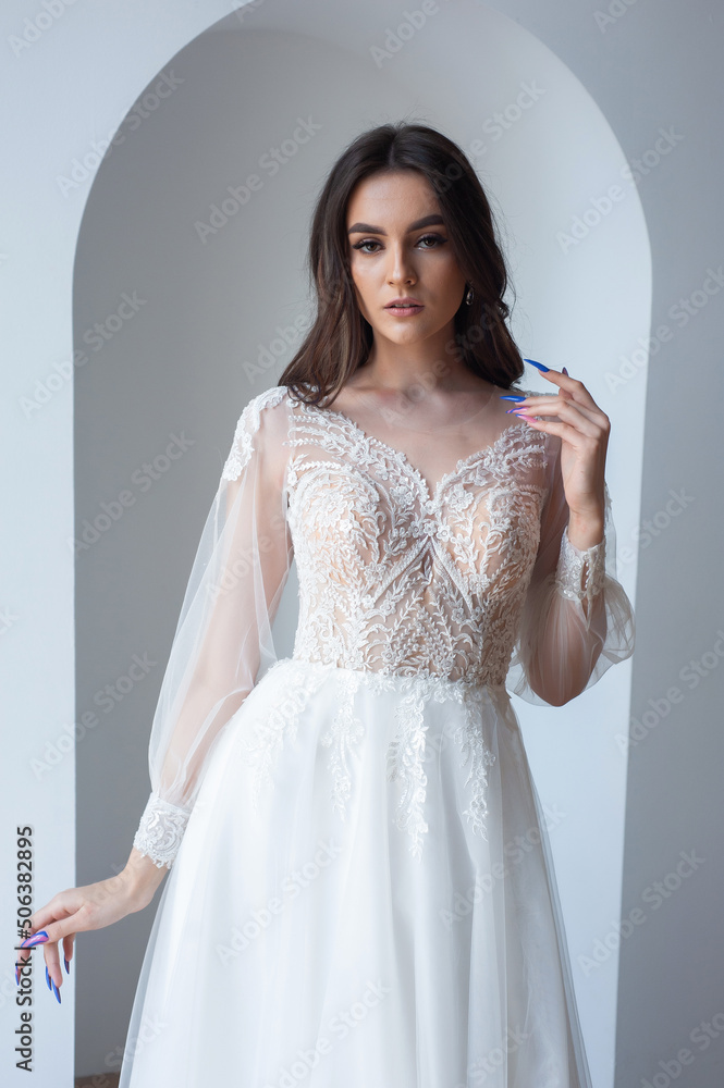 Beautiful bride perfect style. Wedding hairstyle make-up luxury wedding dress Beautiful bride perfect style. Wedding hairstyle make-up luxury wedding dress