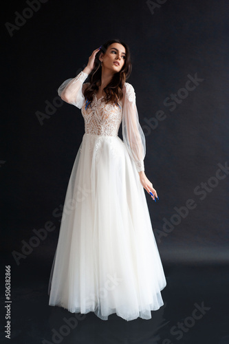 Beautiful bride perfect style. Wedding hairstyle make-up luxury wedding dress